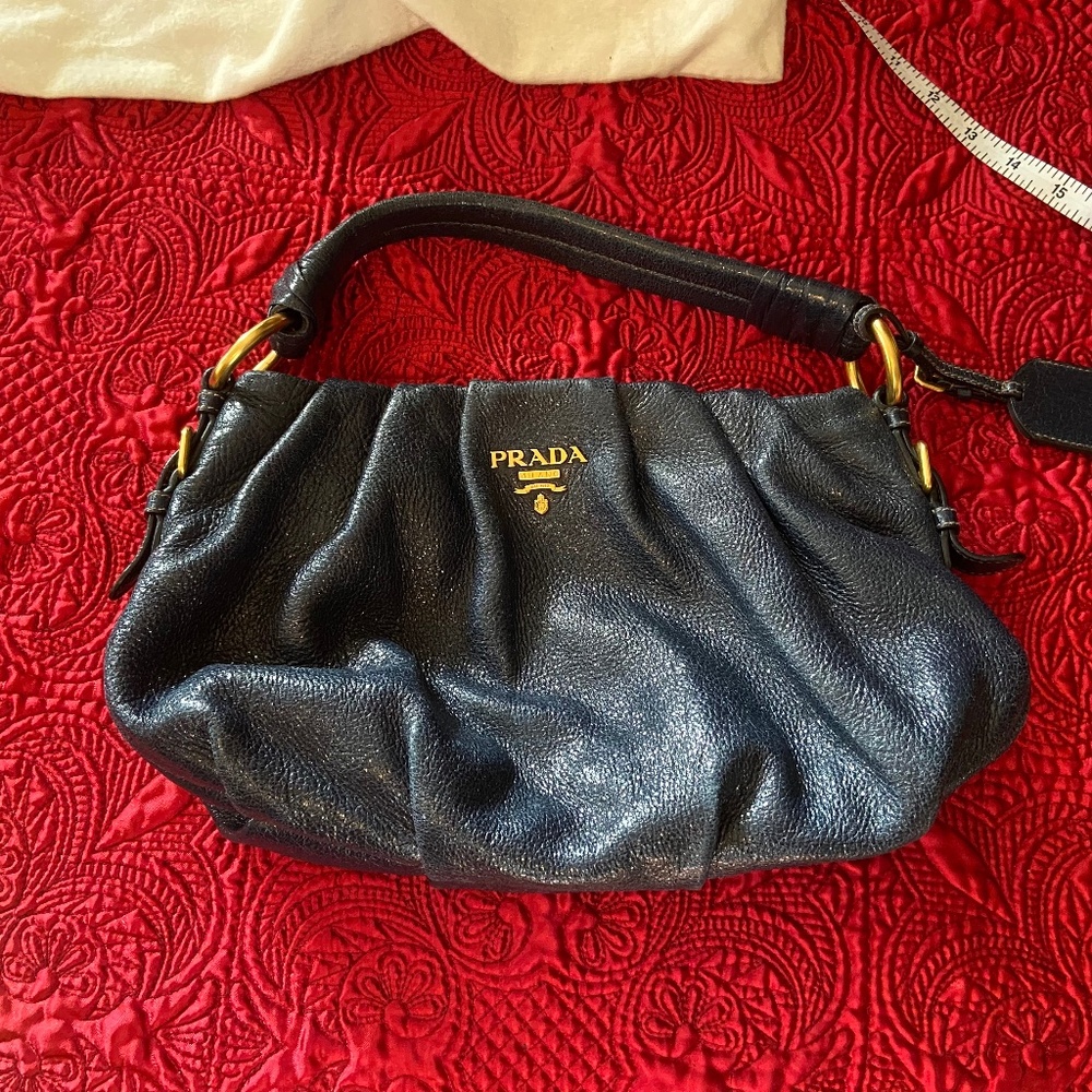 Sparkly genuine leather Prada bag with golden metallic accents